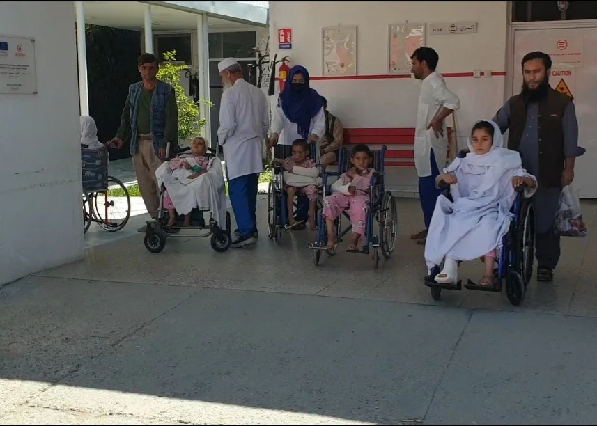 A group pictured with mobility equipment during a 2026 visit
